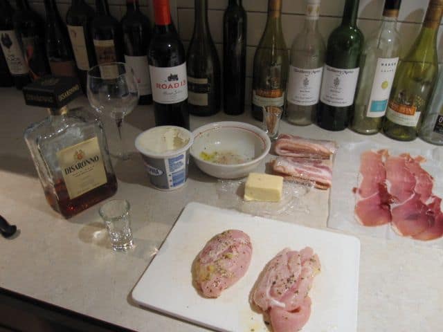 Chicken And Bacon On A Table With Wine And Scotch