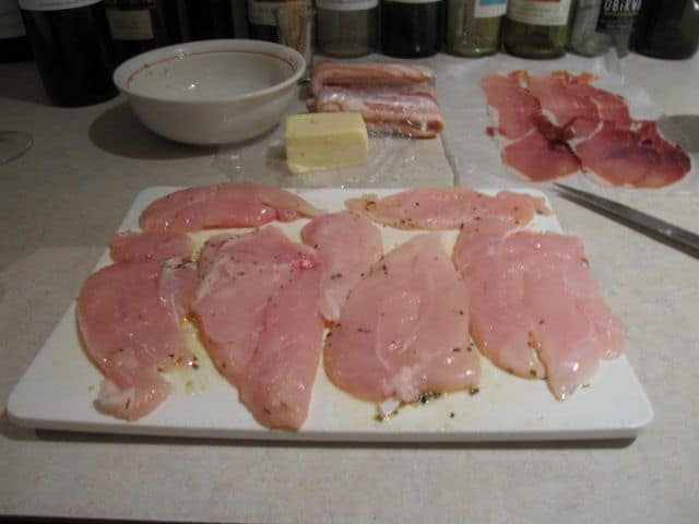 Chicken Breasts On A Table With A Bowl