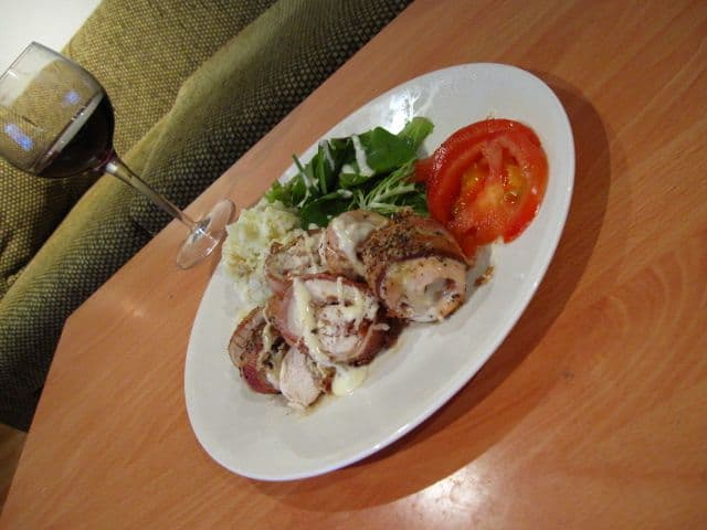 Chicken Wrapped In Bacon With A Tomato Slice
