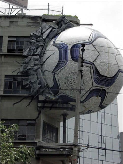 Adidas Soccer Ball Billboard Big adidas soccer ball slams into side of building