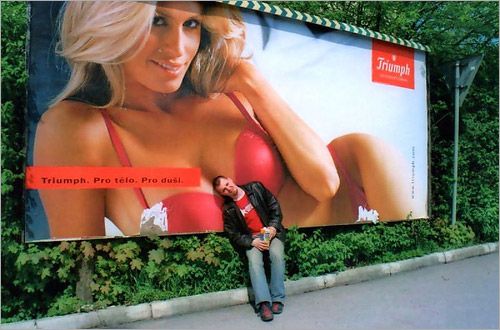 Hot Girl Billboard Guy leaning on boobs on a billboard