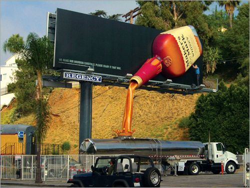 Markers Mark Whiskey Billboard Advertisement with pouring whiskey into truck