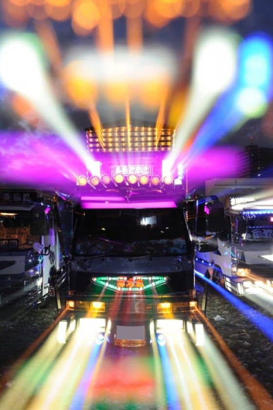 Brightly lit Japanese Trucks with crazy decorations