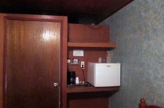 Here's a conveniently placed mini-fridge near the bathroom