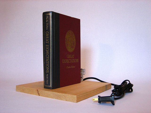 hardcover book on secret passage lamp