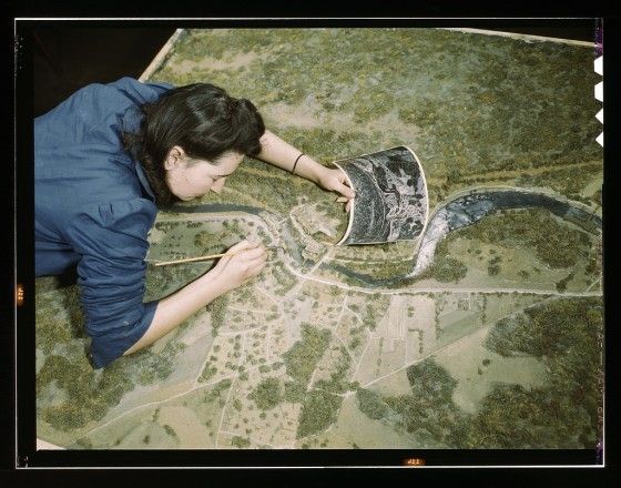 Woman adjusting camouflage 