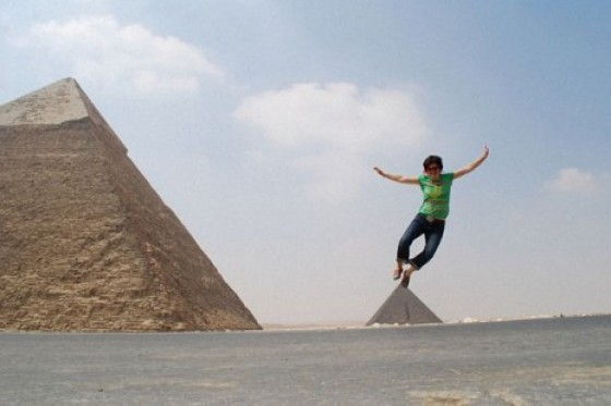 Perfectly Timed Photos woman standing on pyramid