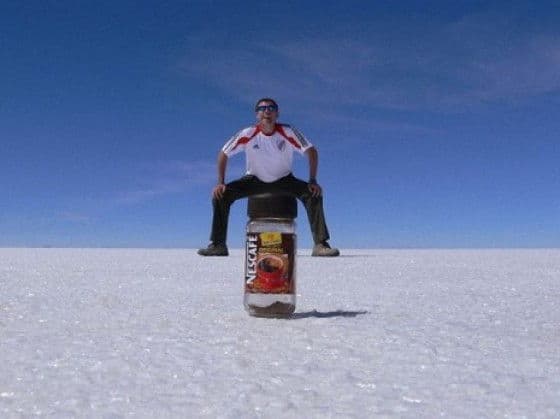Perfectly Timed Photos man sitting on nescafe bottle