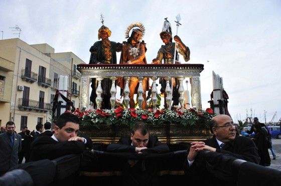 Devotees carry scenes of Christ on their shoulders
