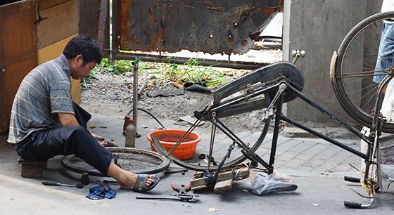 repairing broken bicycle
