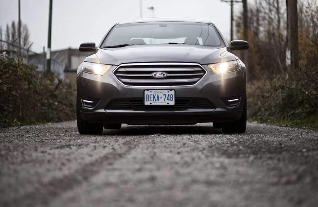 2013 Ford Taurus on dirt road