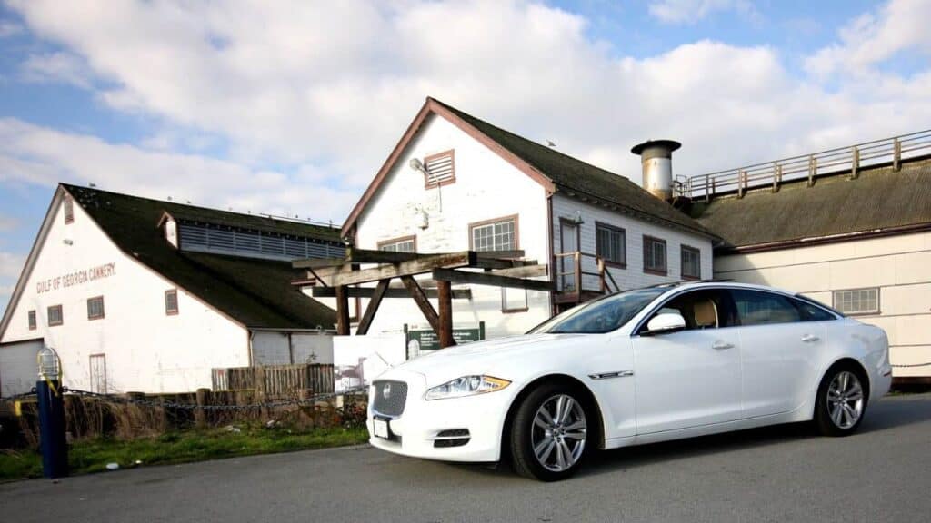 Jaguar XJL next to old building