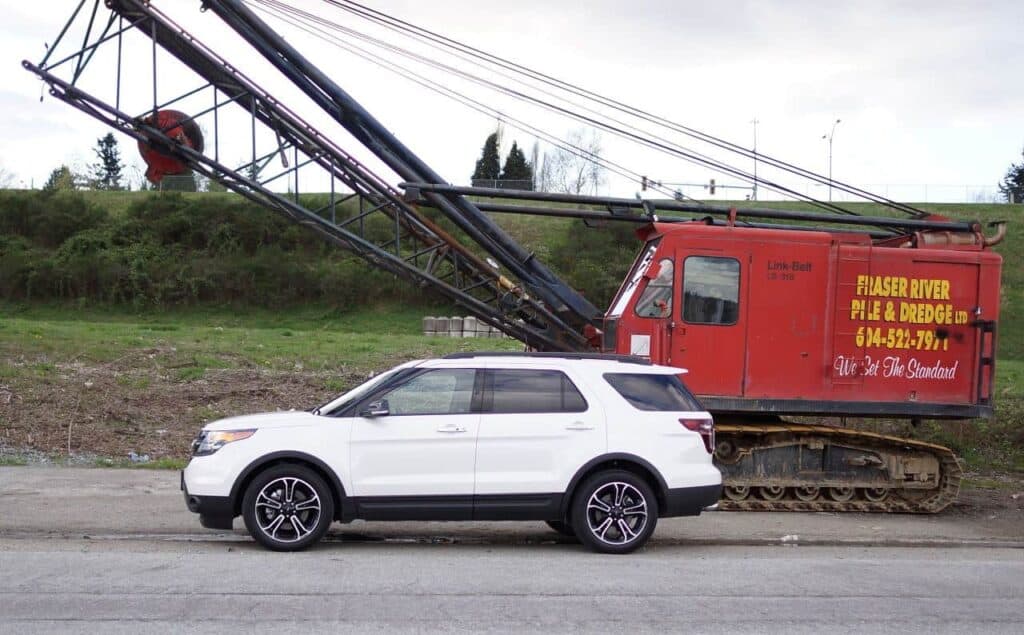Ford Explorer Sport next to crane