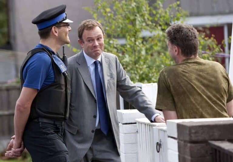 man talking to police