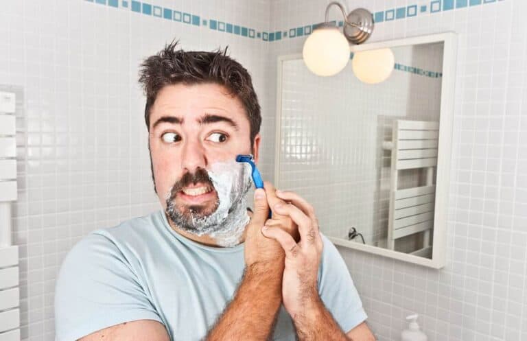 man shaving face