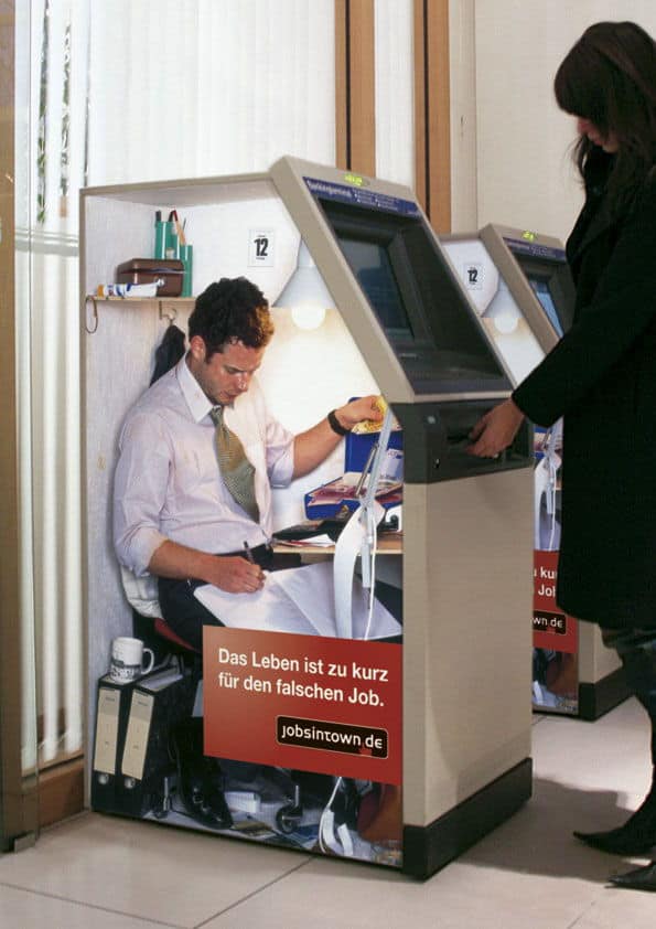 person in bank machine