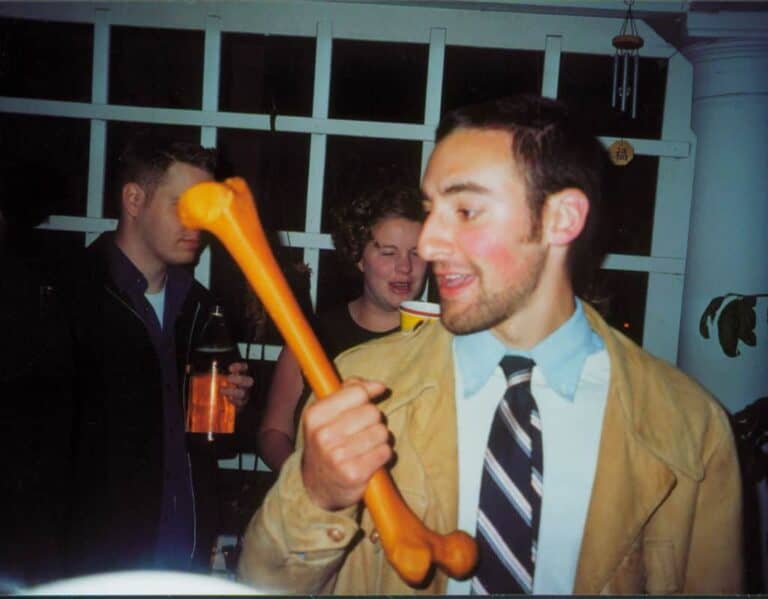 man wearing tie with bone