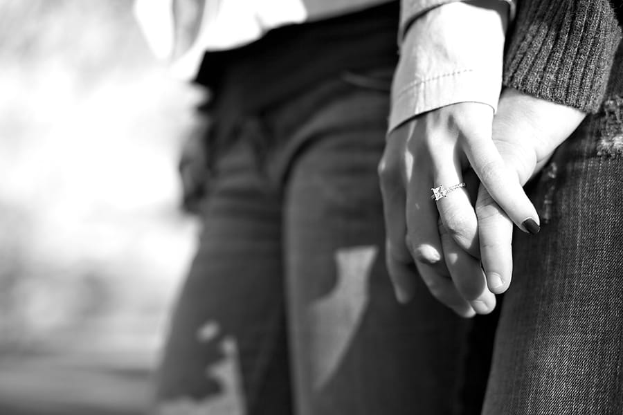 couple wearing wedding rings