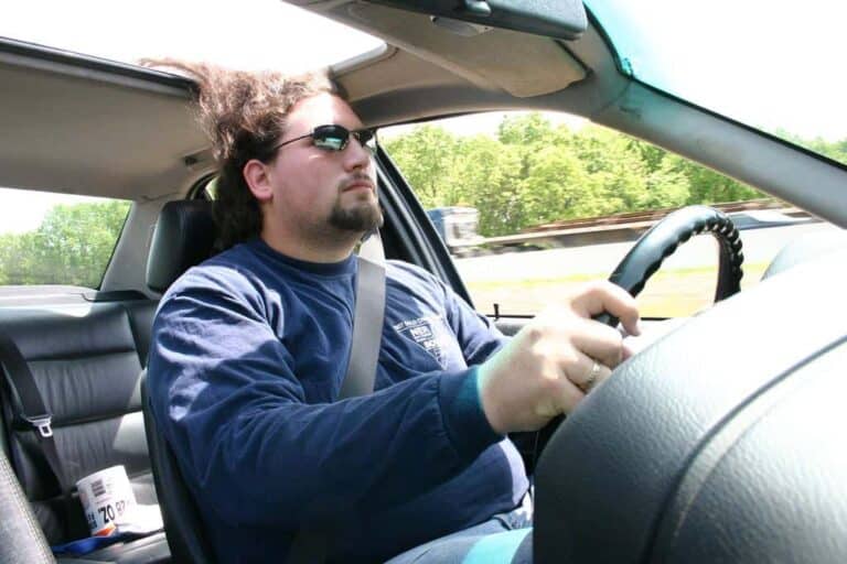 man driving car