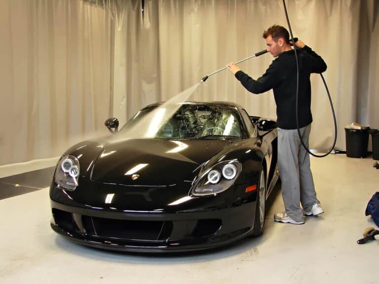 man detailing car