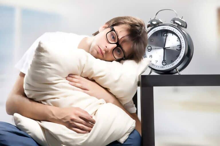 sad man holding pillow