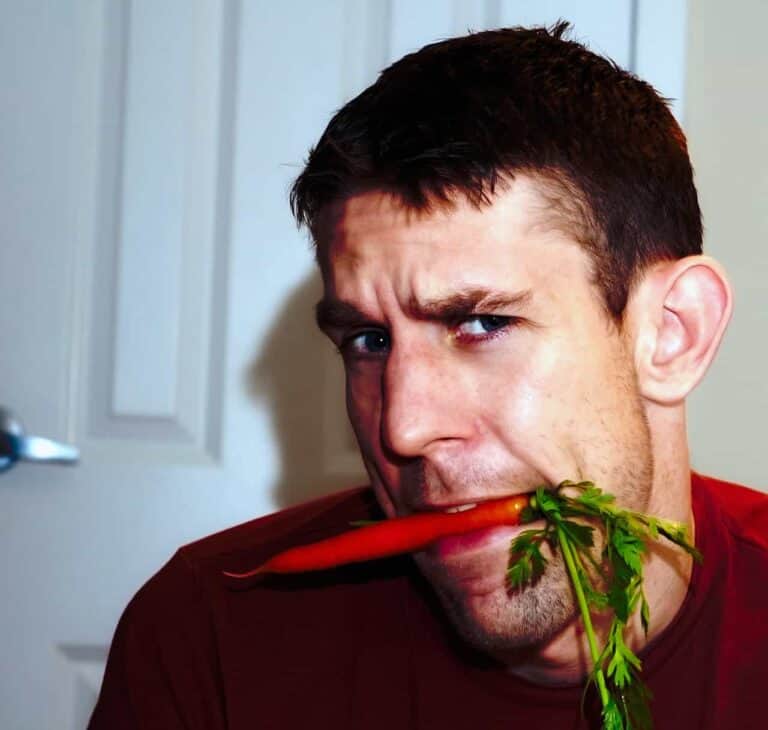man eating veggies