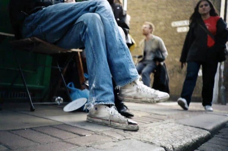 man wearing torn jeans
