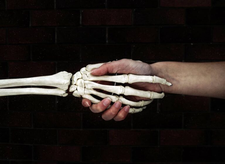 shaking hands with skeleton