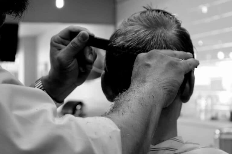 man getting haircut back