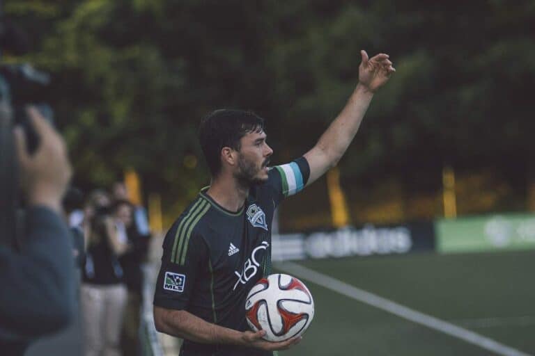 man holding soccer ball