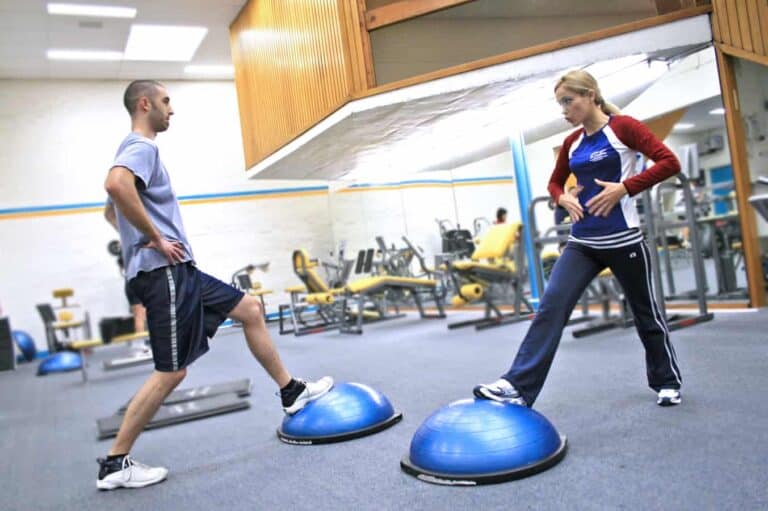 personal trainer using bosu ball