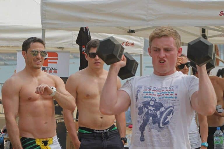 man lifting little weights