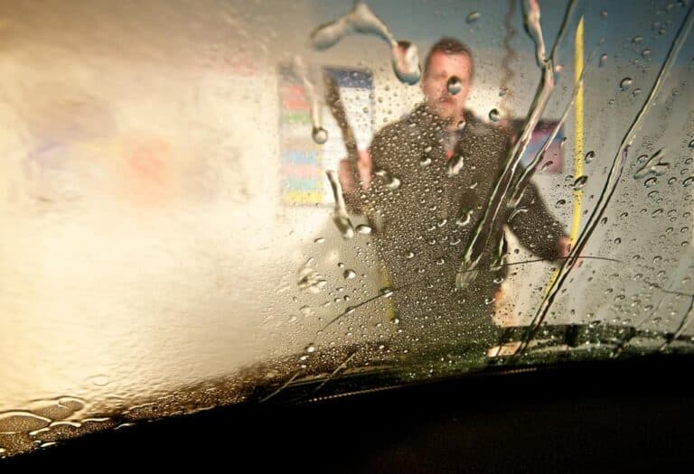 washing car with hose