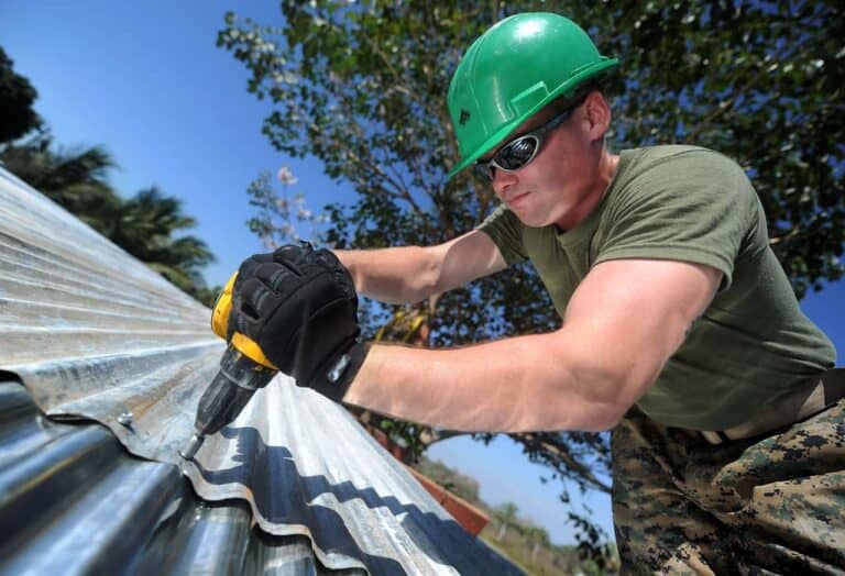 man building roof