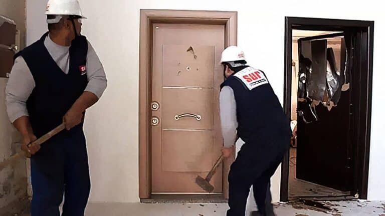 smashing sur doors with sledgehammers