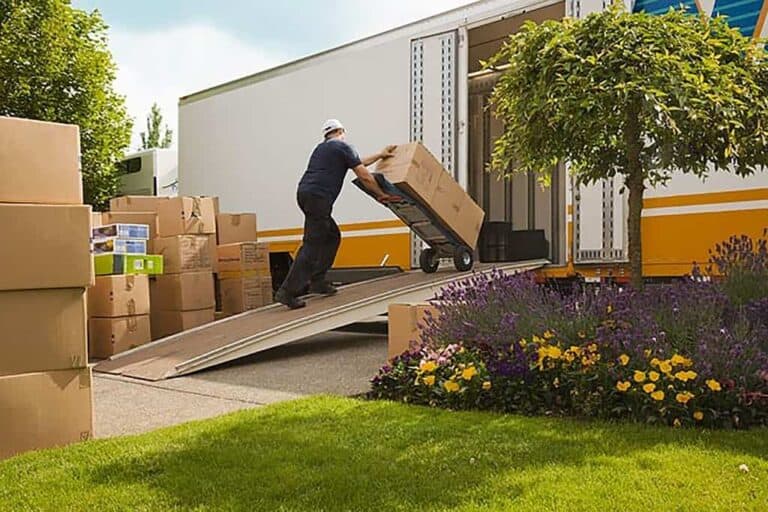 man moving boxes