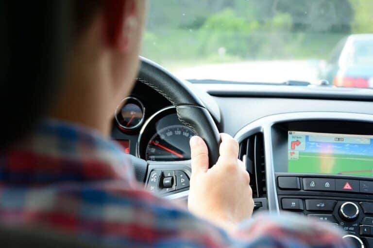 person driving on road navigation