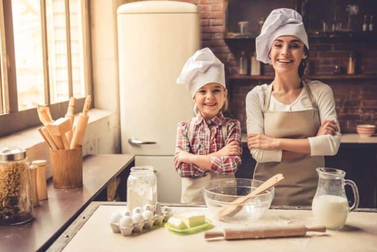 two people cooking