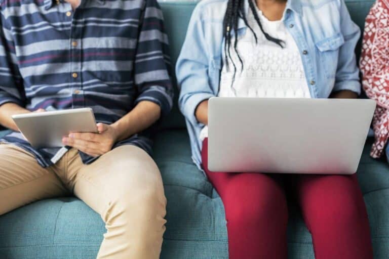 two people using computers