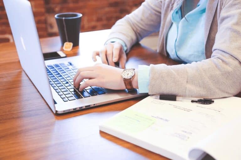 person wearing watch studying