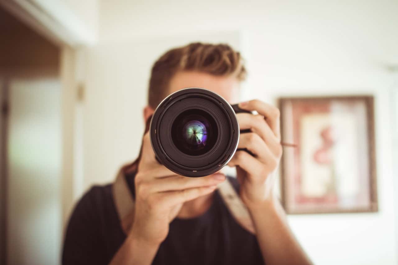 photographer camera lens person