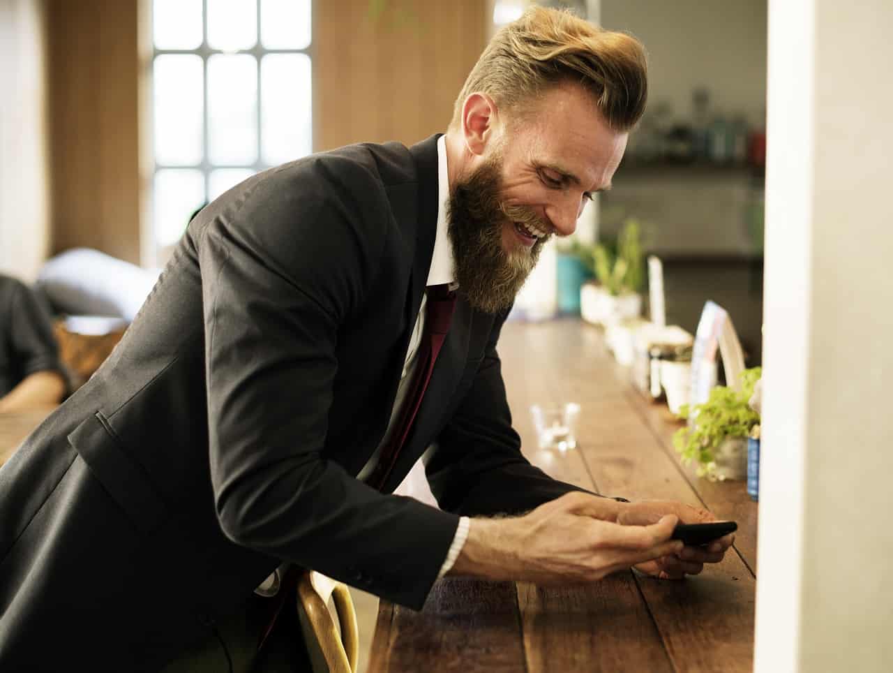 excited man using phone