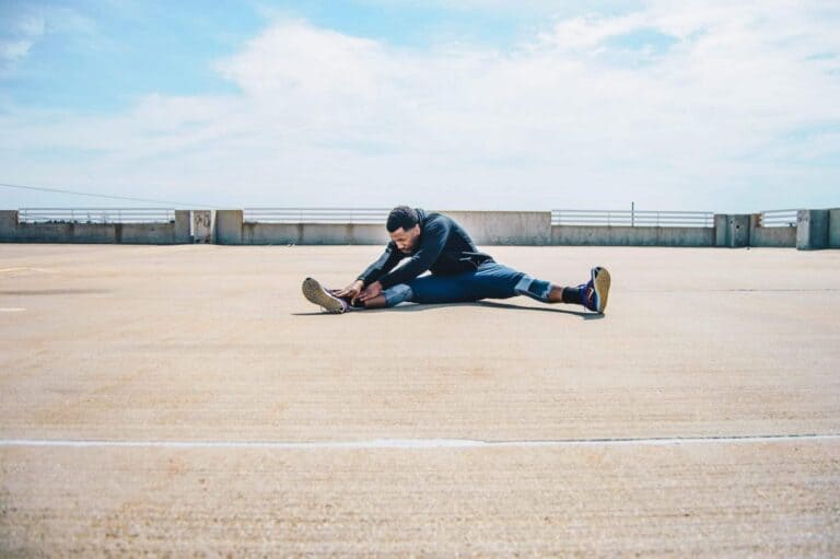 man stretching outside