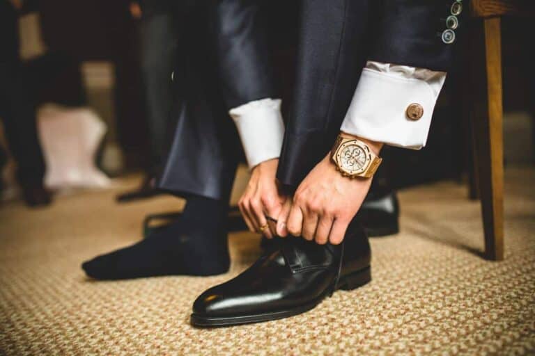 man tying stylish shoes