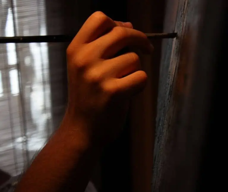 person painting canvas