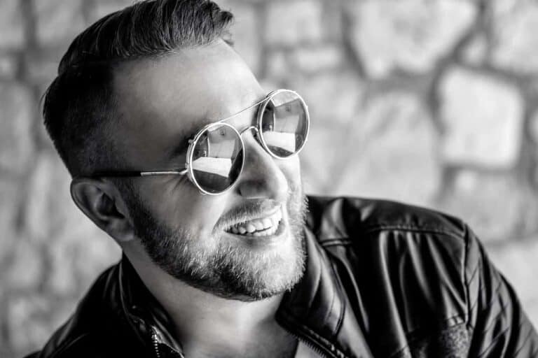 stylish man smiling sunglasses