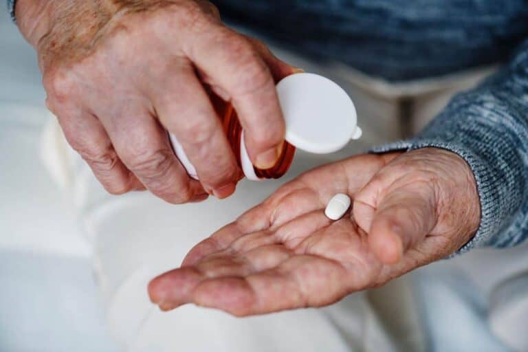 person pills in hand