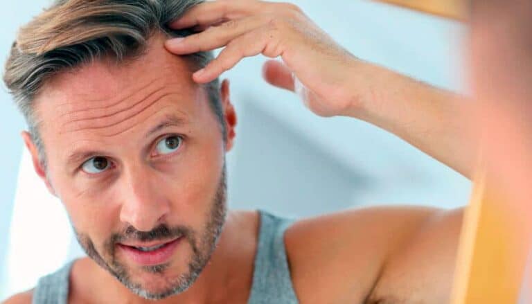 man checking hair
