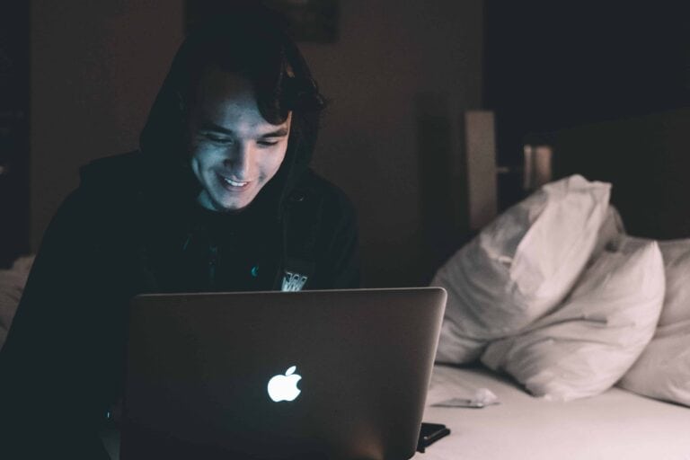 man using notebook computer