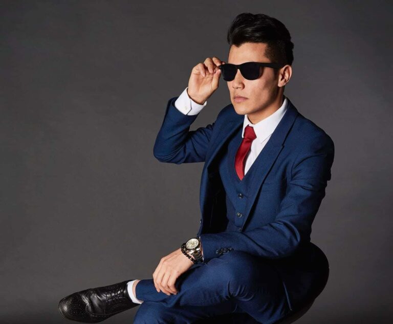 stylish man sunglasses sitting chair